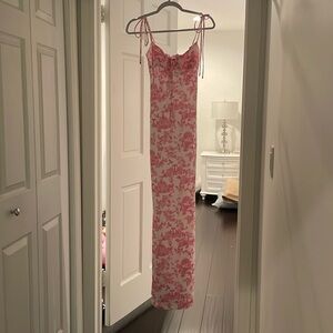 I am selling a tight pink dress and it has never been worn